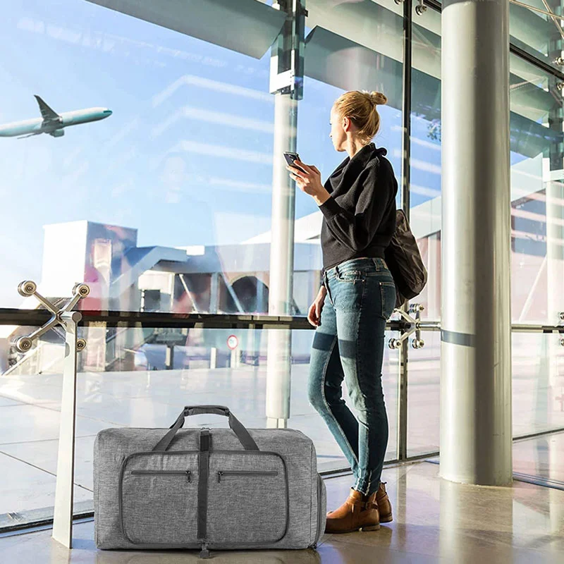 Guangzhou Fuliya Industry Co.,Ltd C-81365 Water-repellent, wear-resistant large foldable travel bag, available in 65L/85L/115L, with adjustable detachable straps, compact fold for easy storage, hand or shoulder carry – ideal for gym, travel, and outdoor.