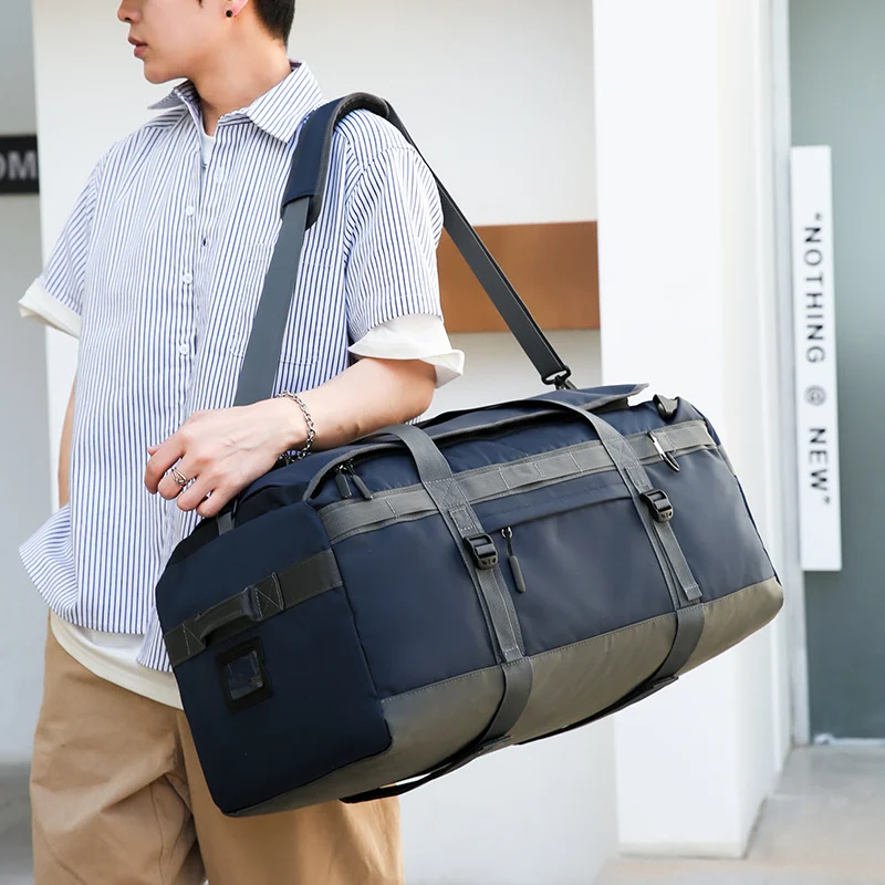 Guangzhou Fuliya Industry Co.,Ltd C-81103 Portable sports travel bag, waterproof fabric, large capacity, comfortable handle, dual zipper, and adjustable strap - hand, shoulder, or backpack carry for fitness, sports, and travel.