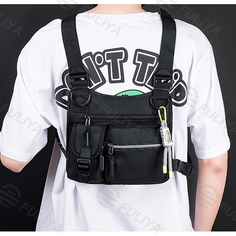 Guangzhou Fuliya Industry Co.,Ltd C-81114 Utility tactical vest chest bag, waterproof and wear-resistant, large capacity, adjustable strap, spring rope, hook, and reflective strips - for street, outdoor, and commuting.