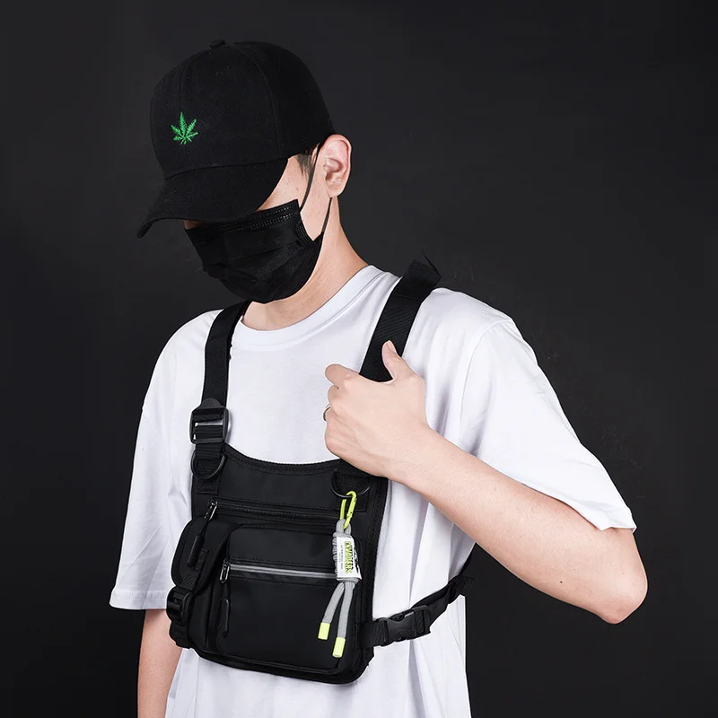 Guangzhou Fuliya Industry Co.,Ltd C-81114 Utility tactical vest chest bag, waterproof and wear-resistant, large capacity, adjustable strap, spring rope, hook, and reflective strips - for street, outdoor, and commuting.