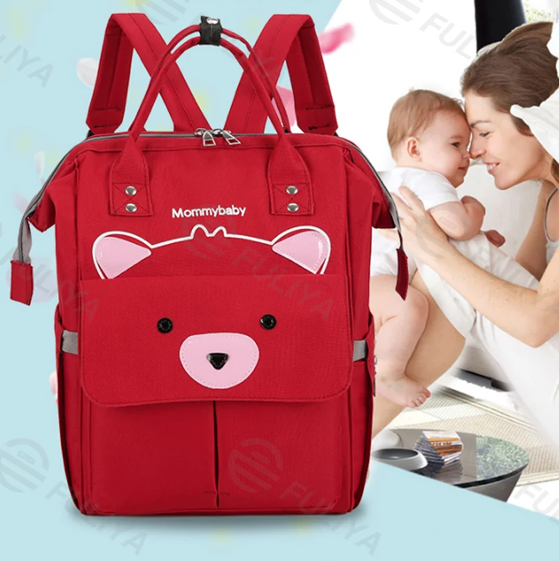 Guangzhou Fuliya Industry Co.,Ltd C-81127 Fashionable mommy backpack, water-resistant, large capacity, foil-insulated bottle pocket, magnetic snap, adjustable buckles, and side pocket - for baby outings and travel.