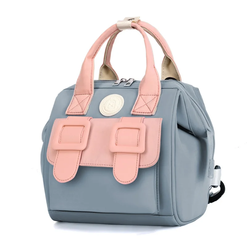 Guangzhou Fuliya Industry Co.,Ltd C-81130 Compact mommy bag, water-resistant, large capacity, foil-insulated bag, front pocket, inner zipper pocket, detachable hook, and long strap - hand, crossbody, or backpack carry for baby outings and pumping.