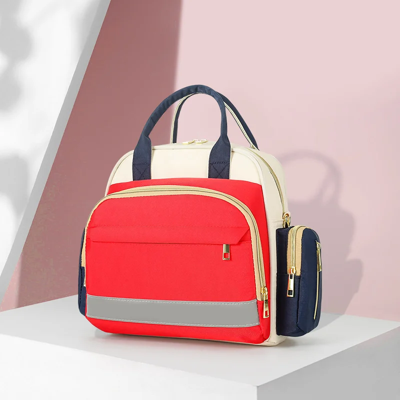Guangzhou Fuliya Industry Co.,Ltd C-81132 Multi-functional mommy bag, water-resistant, large capacity, foil-insulated bag, wet/dry pocket, reflective strip, detachable hook, and luggage strap - hand, shoulder, crossbody, or backpack carry.