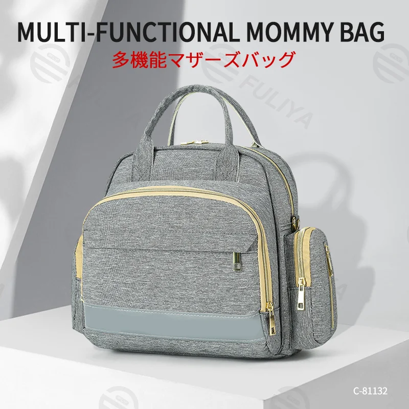Guangzhou Fuliya Industry Co.,Ltd C-81132 Multi-functional mommy bag, water-resistant, large capacity, foil-insulated bag, wet/dry pocket, reflective strip, detachable hook, and luggage strap - hand, shoulder, crossbody, or backpack carry.