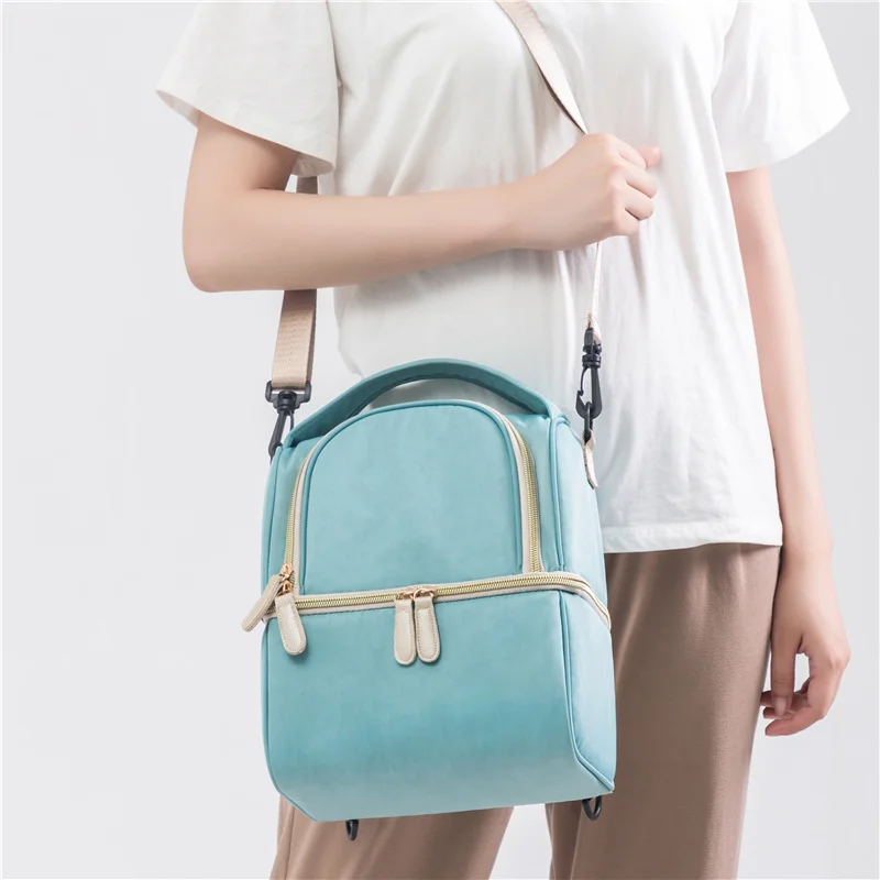 Guangzhou Fuliya Industry Co.,Ltd C-81175 Stylish breast milk cooler bag, water-resistant, dual-layer storage, insulated bottle layer, milk ice pack layer, detachable hook, and adjustable strap - shoulder, hand, or backpack carry for pumping and outings.