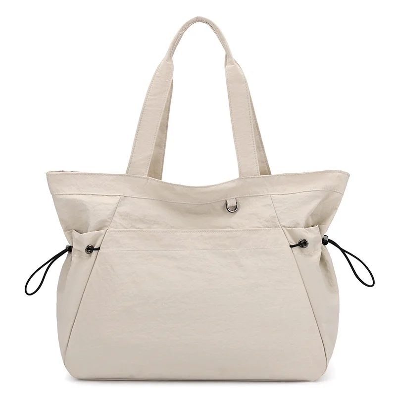 Guangzhou Fuliya Industry Co.,Ltd C-81184 Lightweight waterproof tote bag, large capacity, fits A4, smooth zipper, front/side pockets, D-ring, comfortable handle, and elastic drawstrings - for gym, shopping, travel, and daily use.
