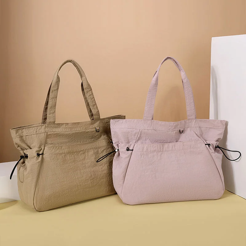 Guangzhou Fuliya Industry Co.,Ltd C-81184 Lightweight waterproof tote bag, large capacity, fits A4, smooth zipper, front/side pockets, D-ring, comfortable handle, and elastic drawstrings - for gym, shopping, travel, and daily use.