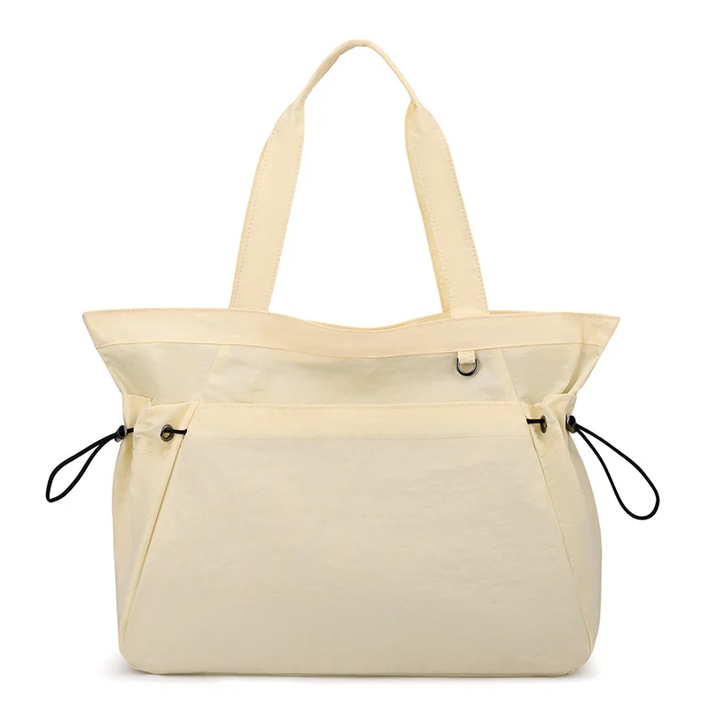 Guangzhou Fuliya Industry Co.,Ltd C-81184 Lightweight waterproof tote bag, large capacity, fits A4, smooth zipper, front/side pockets, D-ring, comfortable handle, and elastic drawstrings - for gym, shopping, travel, and daily use.