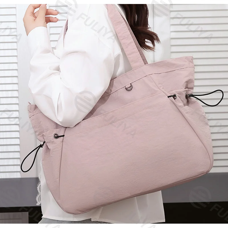 Guangzhou Fuliya Industry Co.,Ltd C-81184 Lightweight waterproof tote bag, large capacity, fits A4, smooth zipper, front/side pockets, D-ring, comfortable handle, and elastic drawstrings - for gym, shopping, travel, and daily use.