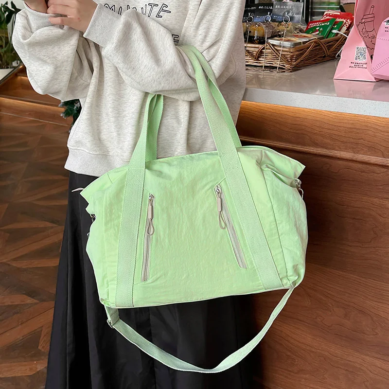 Guangzhou Fuliya Industry Co.,Ltd C-81192 Korean-style casual shoulder bag, water-resistant nylon, large capacity, front/side pockets, detachable hook, and adjustable strap - hand, shoulder, or crossbody carry for travel, outings, and daily use.