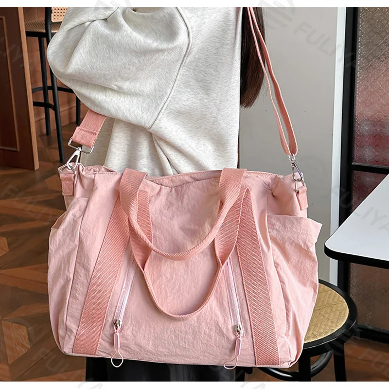 Guangzhou Fuliya Industry Co.,Ltd C-81192 Korean-style casual shoulder bag, water-resistant nylon, large capacity, front/side pockets, detachable hook, and adjustable strap - hand, shoulder, or crossbody carry for travel, outings, and daily use.