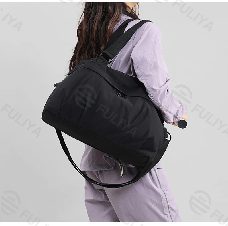 Guangzhou Fuliya Industry Co.,Ltd C-81197 Lightweight travel gym bag, large capacity, front/back zipper pockets, inner pocket, adjustable detachable strap, and luggage sleeve - hand, shoulder, or crossbody carry for travel, fitness, and yoga.