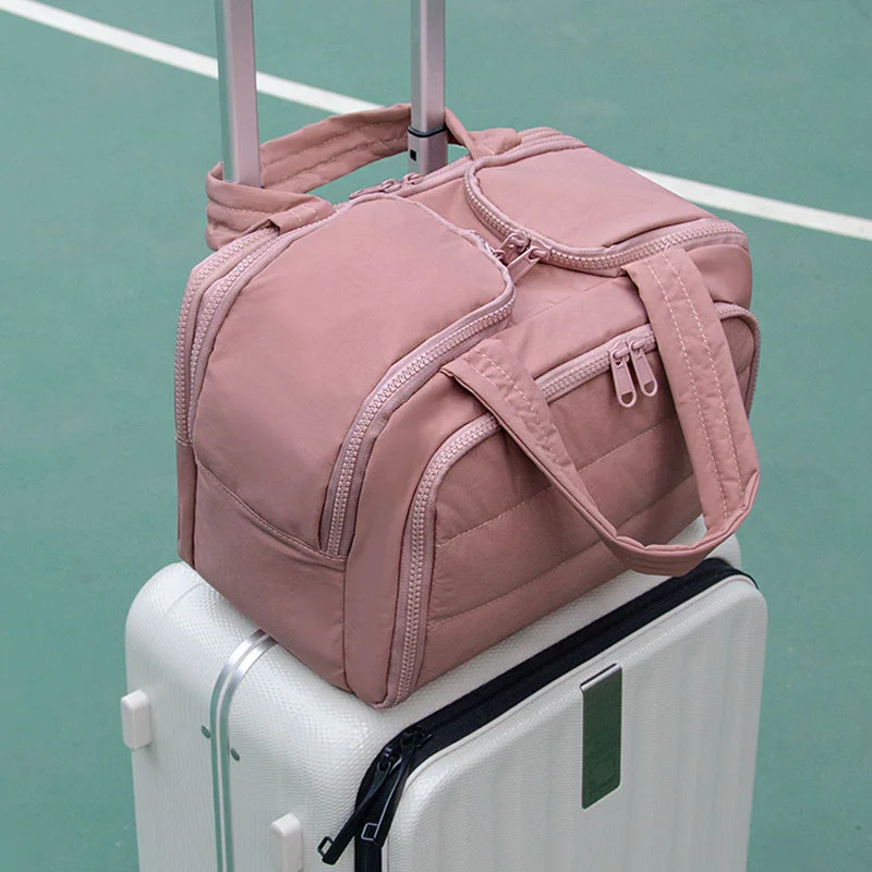 Guangzhou Fuliya Industry Co.,Ltd C-81218 Light luxury hand-carry makeup bag, wet/dry separation, multi-compartment, water-repellent nylon, elastic brush bands, luggage sleeve - for travel and daily use.