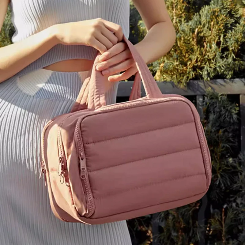 Guangzhou Fuliya Industry Co.,Ltd C-81218 Light luxury hand-carry makeup bag, wet/dry separation, multi-compartment, water-repellent nylon, elastic brush bands, luggage sleeve - for travel and daily use.