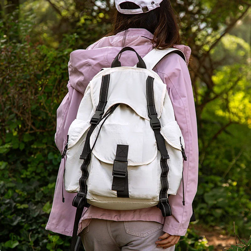 Guangzhou Fuliya Industry Co.,Ltd C-81236 Lightweight waterproof travel backpack, drawstring adjustable, laptop compartment and anti-theft pocket, reflective webbing, non-slip chest strap, and tripod holder - for hiking and daily use.