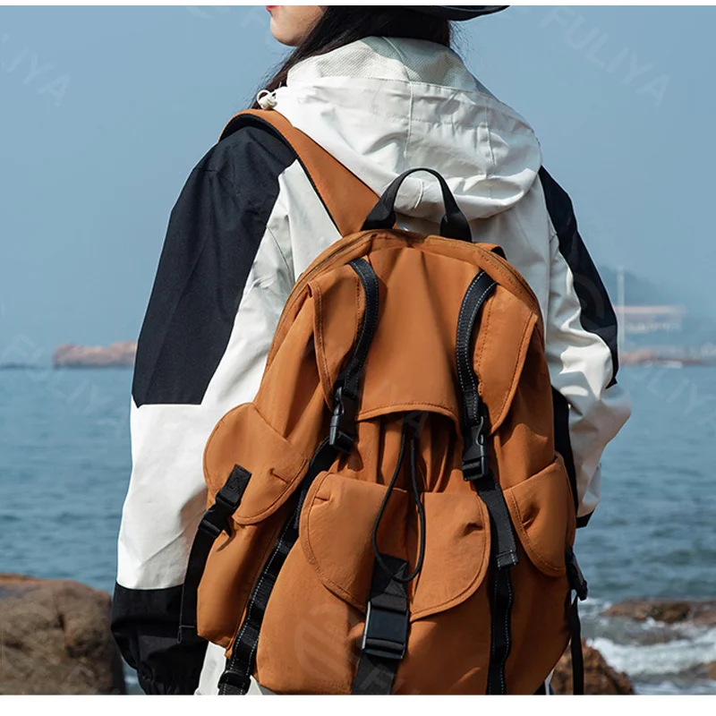 Guangzhou Fuliya Industry Co.,Ltd C-81236 Lightweight waterproof travel backpack, drawstring adjustable, laptop compartment and anti-theft pocket, reflective webbing, non-slip chest strap, and tripod holder - for hiking and daily use.