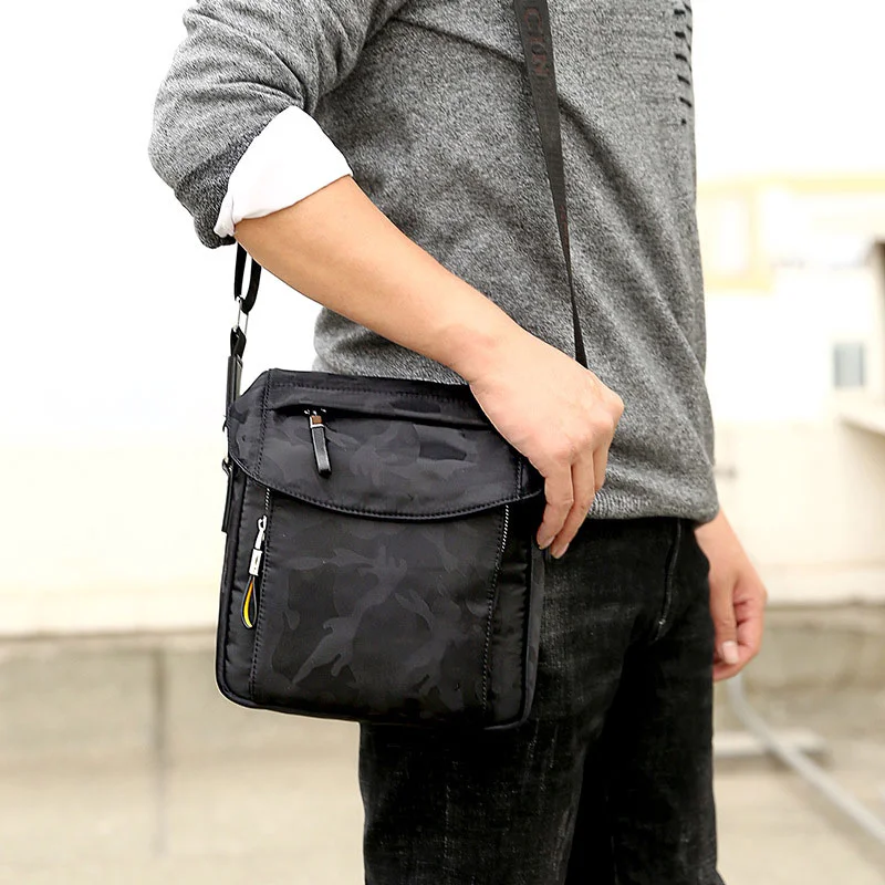 Guangzhou Fuliya Industry Co.,Ltd C-81248 Camouflage crossbody bag, water-resistant, large capacity with multi-layer storage, headphone port, front magnetic pocket, hidden zipper pocket, and adjustable buckle - for commuting, travel, and daily use.