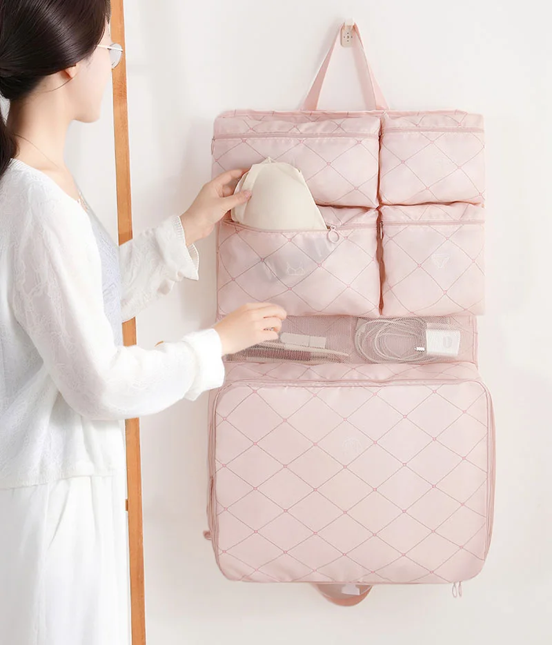 Guangzhou Fuliya Industry Co.,Ltd C-81253 Portable 7-in-1 travel organizer hanging bag, large capacity with multi-compartments, hanging or carrying, see-through mesh pocket, smooth zipper, top handle, washable, quick-fold - for travel and business trips.