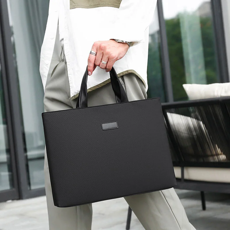 Guangzhou Fuliya Industry Co.,Ltd C-81254 Business laptop handbag, water-resistant and durable, large capacity with compartments, back zipper pocket, reinforced corners, and comfortable handle - for office, business trips, and commuting.