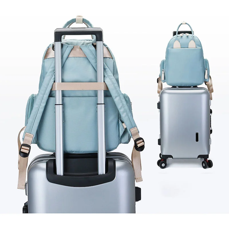 Guangzhou Fuliya Industry Co.,Ltd C-81286 Stylish mommy backpack, hand, shoulder, or backpack carry, multi-pocket organization, wet/dry pocket, foil-insulated bottle pocket, side pockets, and luggage strap - for baby outings and travel.
