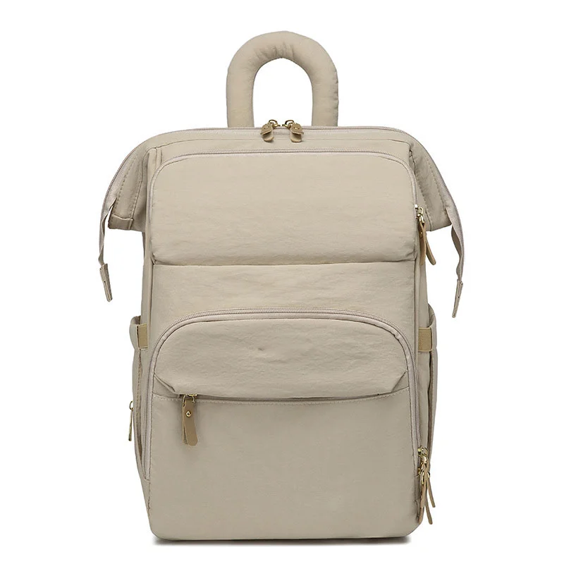 Guangzhou Fuliya Industry Co.,Ltd C-81299  Mommy backpack, water-resistant, large capacity, insulated bottle compartment, wide-opening main pocket, side tissue pocket, and comfortable handle - for baby outings.