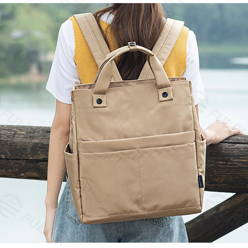 Guangzhou Fuliya Industry Co.,Ltd C-81324 Lightweight large-capacity backpack, crossbody or backpack carry, back zipper pocket conceals straps to convert into a handheld bag, multiple pockets - for business, travel, and casual.