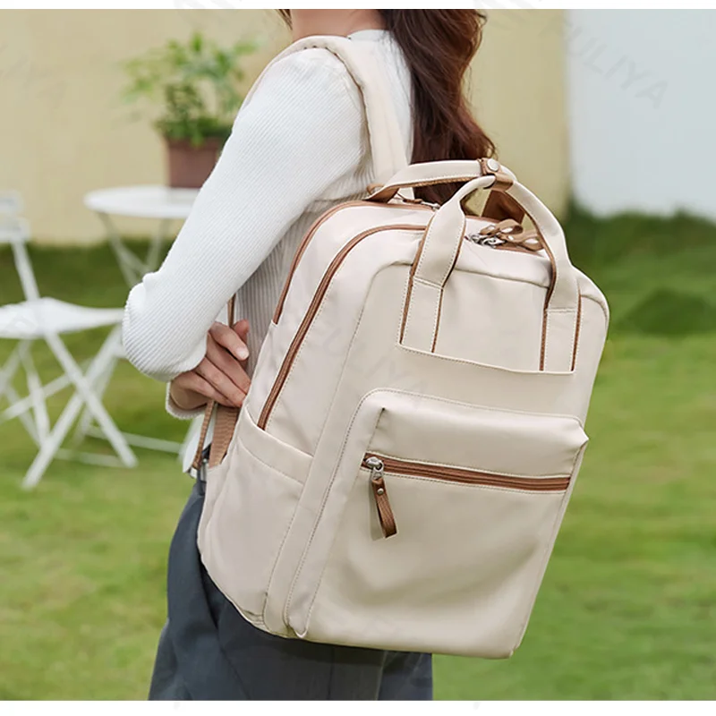 Guangzhou Fuliya Industry Co.,Ltd C-81327 Large-capacity backpack, multi-layer storage, dedicated laptop compartment, magnetic front pocket, luggage sleeve, adjustable shoulder straps - suitable for commuting, travel, and daily use.