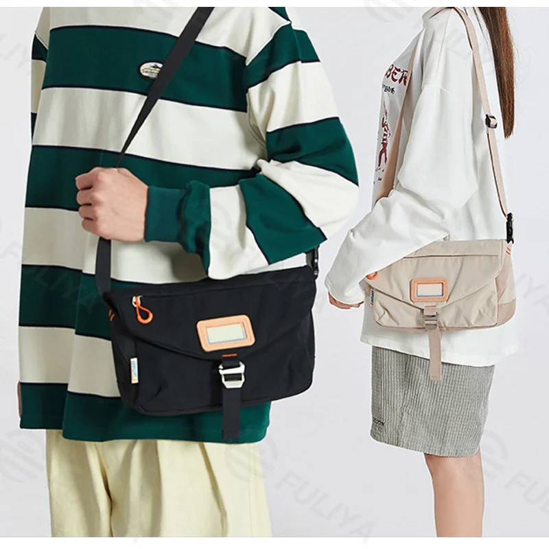 Guangzhou Fuliya Industry Co.,Ltd C-81334 Utility-style large-capacity crossbody bag, multi-compartment design , water-repellent durable fabric, quick-release buckle and adjustable strap - for campus and daily use.
