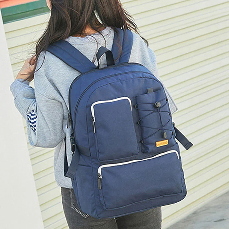 Guangzhou Fuliya Industry Co.,Ltd C-81339 Large-capacity backpack with laptop compartment, drawstring front pocket, multiple zipper pockets, side slip pocket, and luggage sleeve - suitable for travel, commuting, and campus.