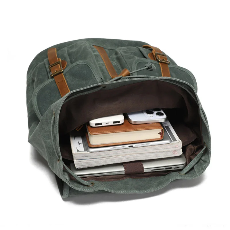 Guangzhou Fuliya Industry Co.,Ltd C-81341 This vintage waterproof backpack features oil-waxed canvas, drawstring and metal flap buckle closure, built-in laptop sleeve and multiple pockets, large capacity - ideal for travel, outdoor, and school.