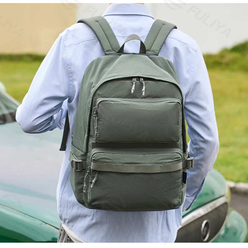 Guangzhou Fuliya Industry Co.,Ltd C-81347 Made of durable waterproof fabric, with large capacity, built-in laptop sleeve and multiple pockets, breathable shoulder straps, and luggage pass-through sleeve - ideal for commuting, travel, and school.