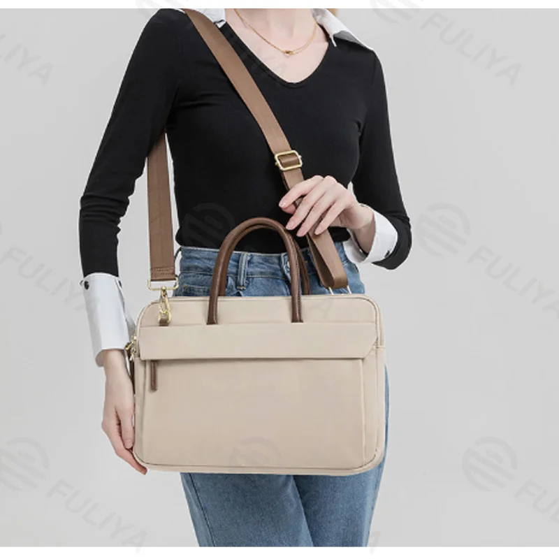 Guangzhou Fuliya Industry Co.,Ltd C-81386 This lightweight waterproof laptop bag features large inner pockets, back pockets, hidden front zipper pocket, and luggage strap - ideal for commuting and business.