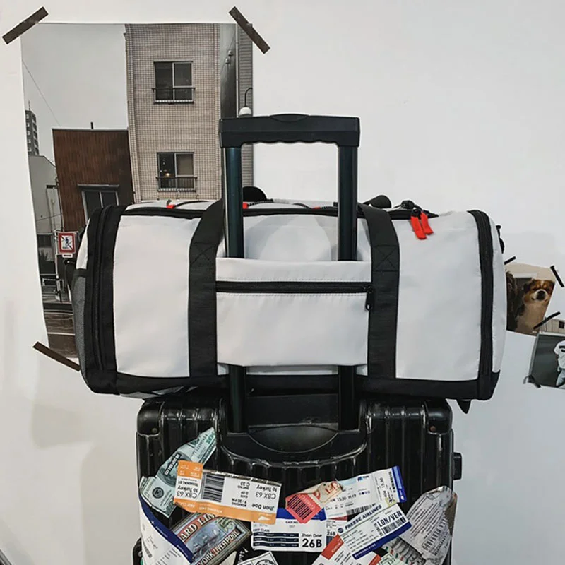 Guangzhou Fuliya Industry Co.,Ltd C-81389 This multi-functional travel bag features water-repellent fabric, a separate shoe compartment, wet/dry separation pocket, and adjustable shoulder strap - perfect for gym, travel, and daily use.