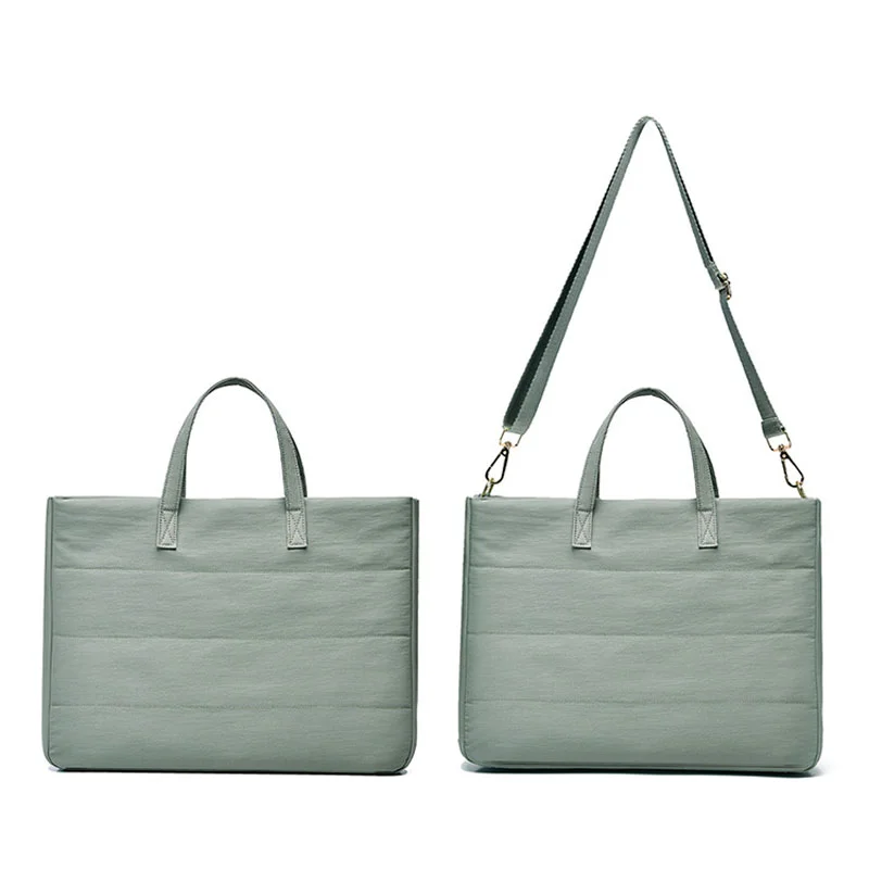 Guangzhou Fuliya Industry Co.,Ltd C-81401 This versatile tote bag is water-repellent and scratch-resistant, with air-cushion protection, large capacity for a laptop, detachable shoulder strap, and trolley strap - perfect for commuting and travel.