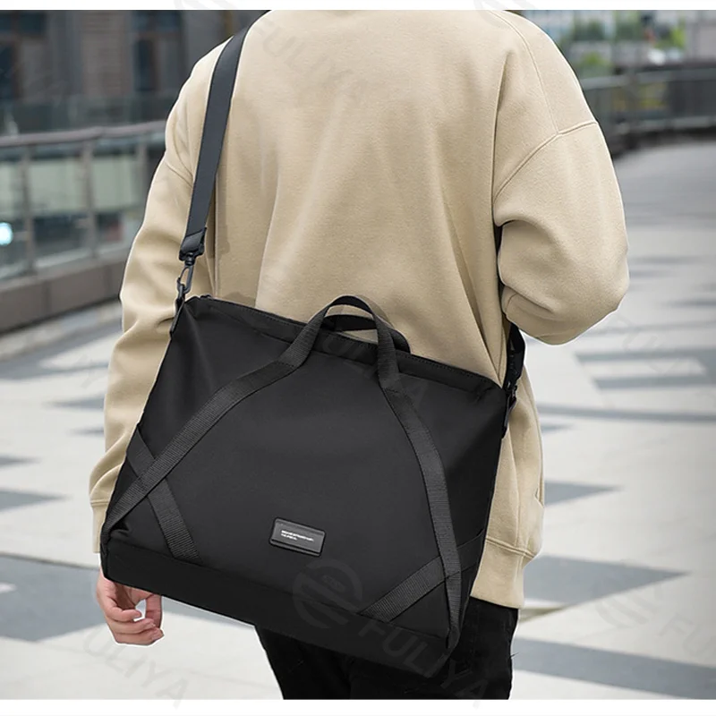 Guangzhou Fuliya Industry Co.,Ltd C-81403 This nylon & PU leather bag is water-repellent, large-capacity for a laptop, with comfortable handle and detachable shoulder strap - perfect for commuting, business, and school.
