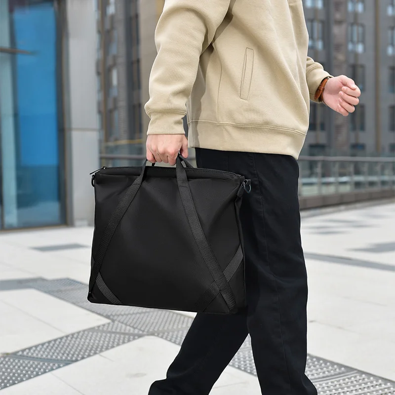 Guangzhou Fuliya Industry Co.,Ltd C-81403 This nylon & PU leather bag is water-repellent, large-capacity for a laptop, with comfortable handle and detachable shoulder strap - perfect for commuting, business, and school.
