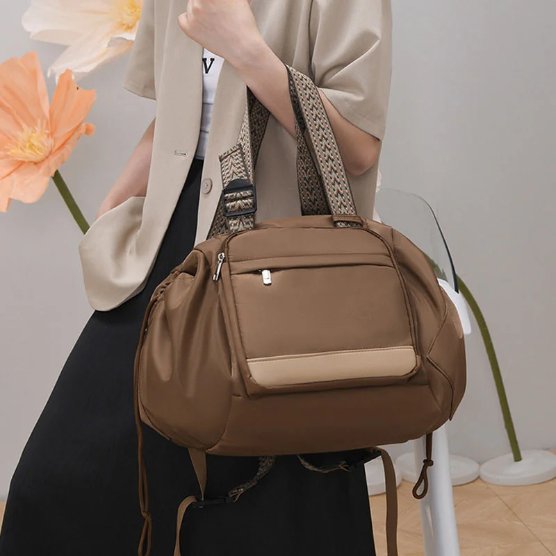 Guangzhou Fuliya Industry Co.,Ltd C-81405 This foldable mommy bag features a separate wet/dry compartment, transforms into a shopping basket or carry cot, fits over luggage handles, and is easy to carry.