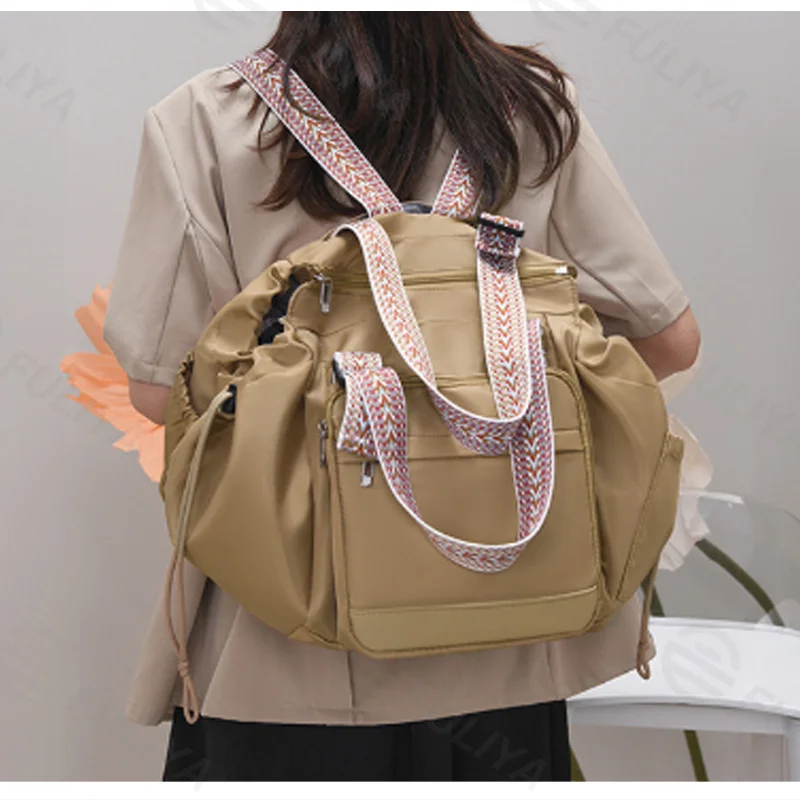 Guangzhou Fuliya Industry Co.,Ltd C-81405 This foldable mommy bag features a separate wet/dry compartment, transforms into a shopping basket or carry cot, fits over luggage handles, and is easy to carry.