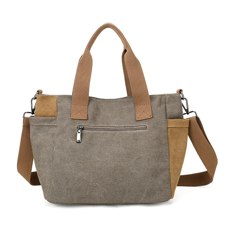 Guangzhou Fuliya Industry Co.,Ltd C-81447 This spliced canvas bag is lightweight and versatile, with hand/shoulder/crossbody carry, multi‑layer pockets, adjustable strap, and side pocket – for commuting and campus.