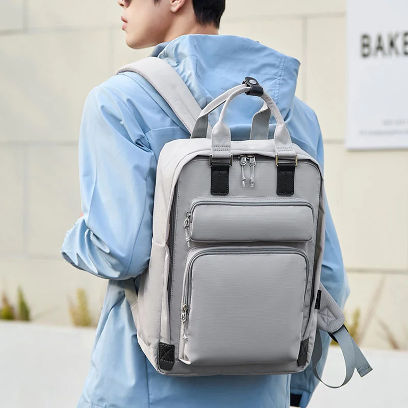 Guangzhou Fuliya Industry Co.,Ltd C-81464 This versatile backpack fits a laptop, is water‑repellent and stain‑resistant, includes a detachable insulated bottle pouch, and has a trolley strap – suitable for business, commuting, and family outings.