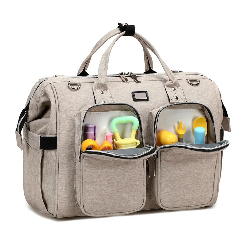 Guangzhou Fuliya Industry Co.,Ltd C-80802 Waterproof large-capacity diaper tote bag, supports hand/shoulder/crossbody carry. Features stroller hooks, front pockets, and a changing pad. For baby daily travel.