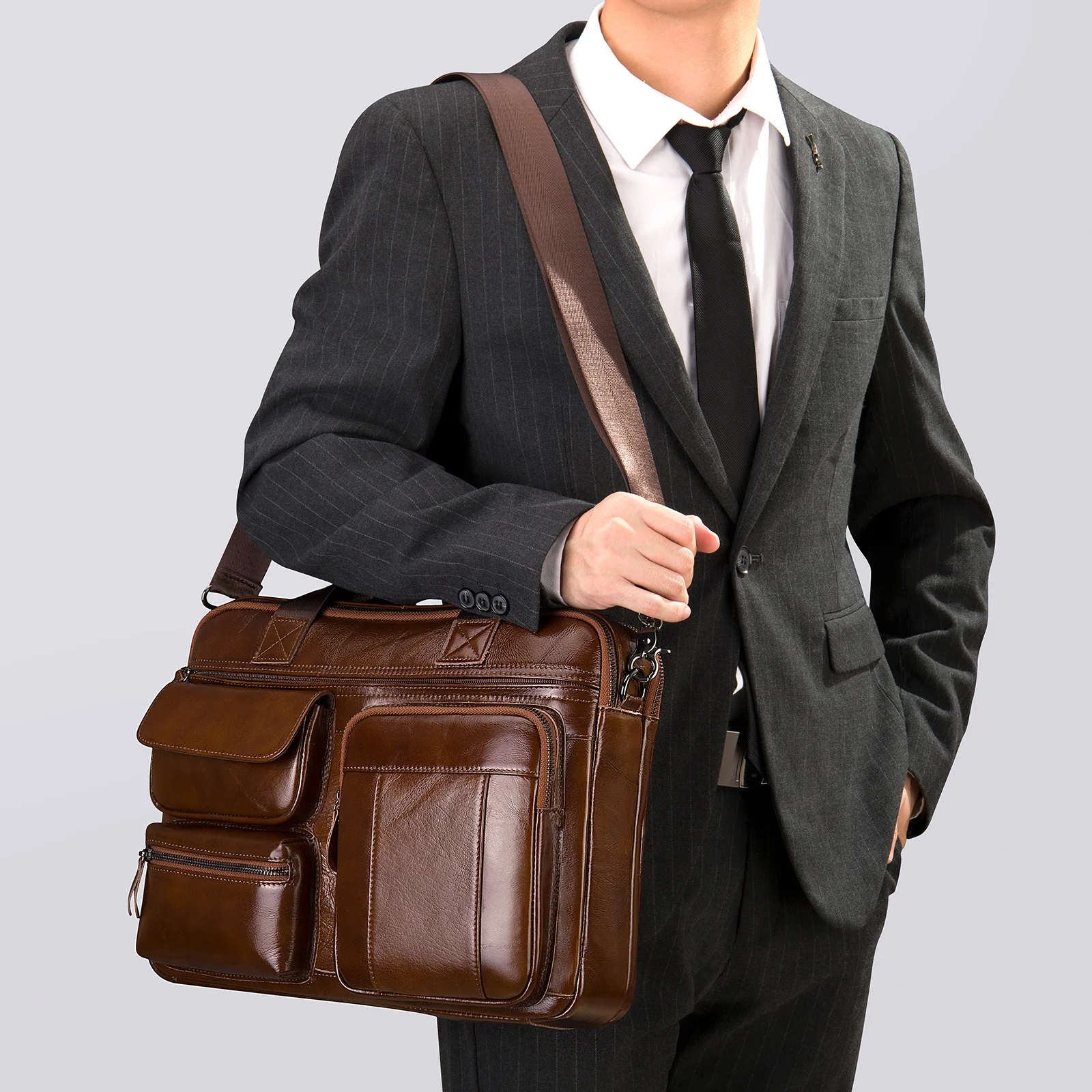 Guangzhou Fuliya Industry Co.,Ltd C-80908 Men's top-grain cowhide briefcase, large capacity, multi-functional pockets, rear anti-theft pocket, magnetic buckle, and adjustable strap - hand or shoulder carry for business, commuting, and business trips.