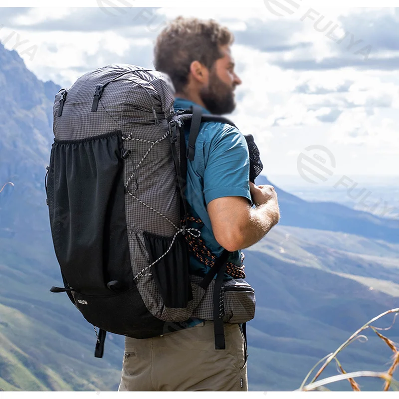 Guangzhou Fuliya Industry Co.,Ltd C-80917 Lightweight outdoor hiking backpack, water-resistant, large capacity, rain cover, elastic cords, expandable opening, and adjustable straps - 40L/60L for camping, hiking, and travel.