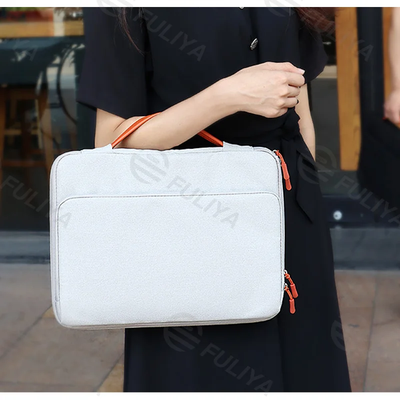 Guangzhou Fuliya Industry Co.,Ltd C-80954 16-inch shockproof laptop bag with 360° padding. Full-open design with laptop and accessory compartments, trolley sleeve, and retractable handle. For commuting and business trips.