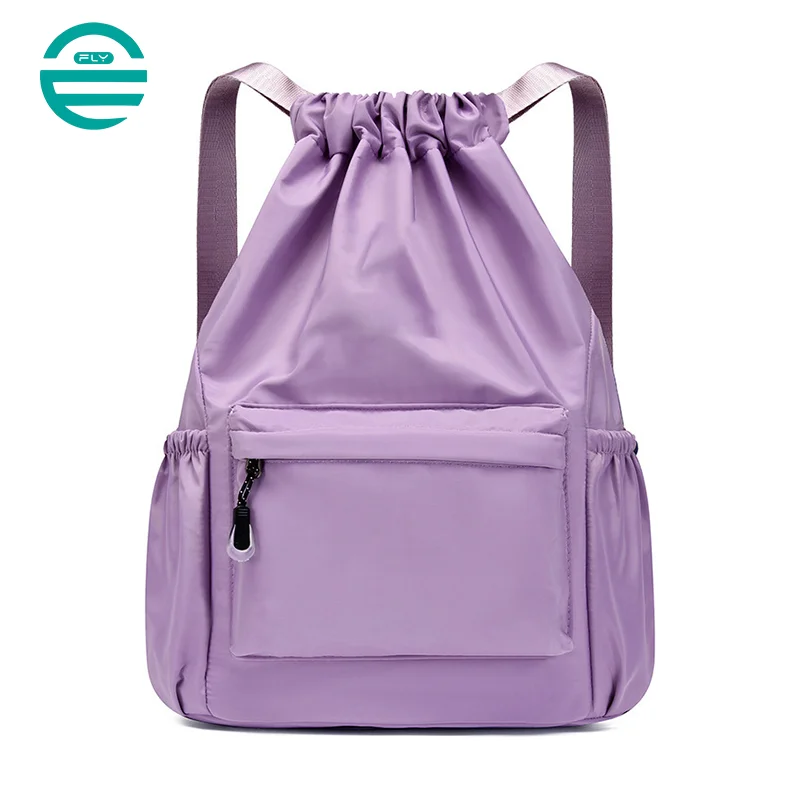 Guangzhou Fuliya Industry Co.,Ltd C-80956 Water-resistant drawstring backpack with durable water-repellent fabric and a wet/dry separation bag. Drawstring closure and adjustable straps. Lightweight and sturdy. For sports, travel, and daily use.