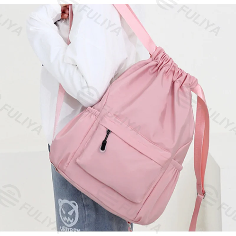 Guangzhou Fuliya Industry Co.,Ltd C-80956 Water-resistant drawstring backpack with durable water-repellent fabric and a wet/dry separation bag. Drawstring closure and adjustable straps. Lightweight and sturdy. For sports, travel, and daily use.