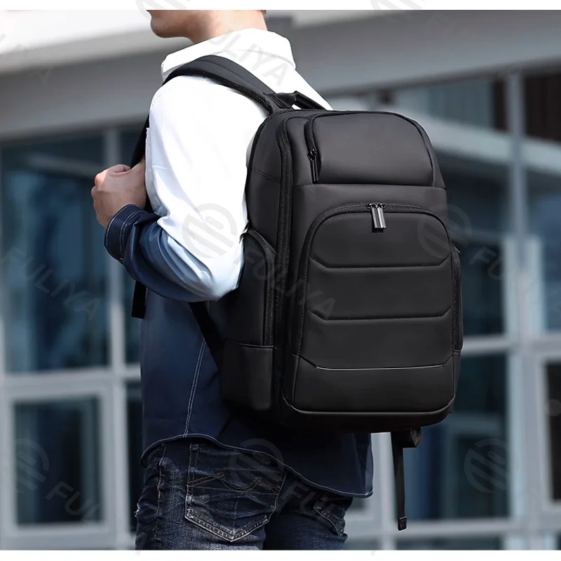 Guangzhou Fuliya Industry Co.,Ltd C-80964 Expandable business backpack, fits 15.6" laptop. Expands 6cm up to 39L. Features water-resistant fabric, multi-layer storage, USB port, and hidden anti-theft back pocket. For short trips and commuting.