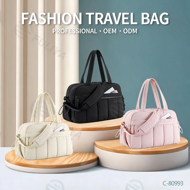 Guangzhou Fuliya Industry Co.,Ltd C-80993 Lightweight quilted sports travel bag with wet/dry PVC pocket. Multi-pockets, padded strap, and trolley sleeve. Hand/shoulder/crossbody carry. For gym, swimming, and short trips.
