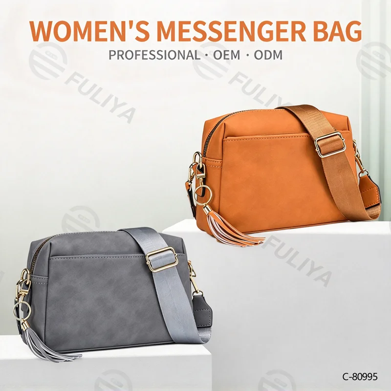 Guangzhou Fuliya Industry Co.,Ltd C-80995 Retro soft leather crossbody bag with detachable tassel and wide strap. Multi-compartment design for daily essentials. For commuting and casual wear.