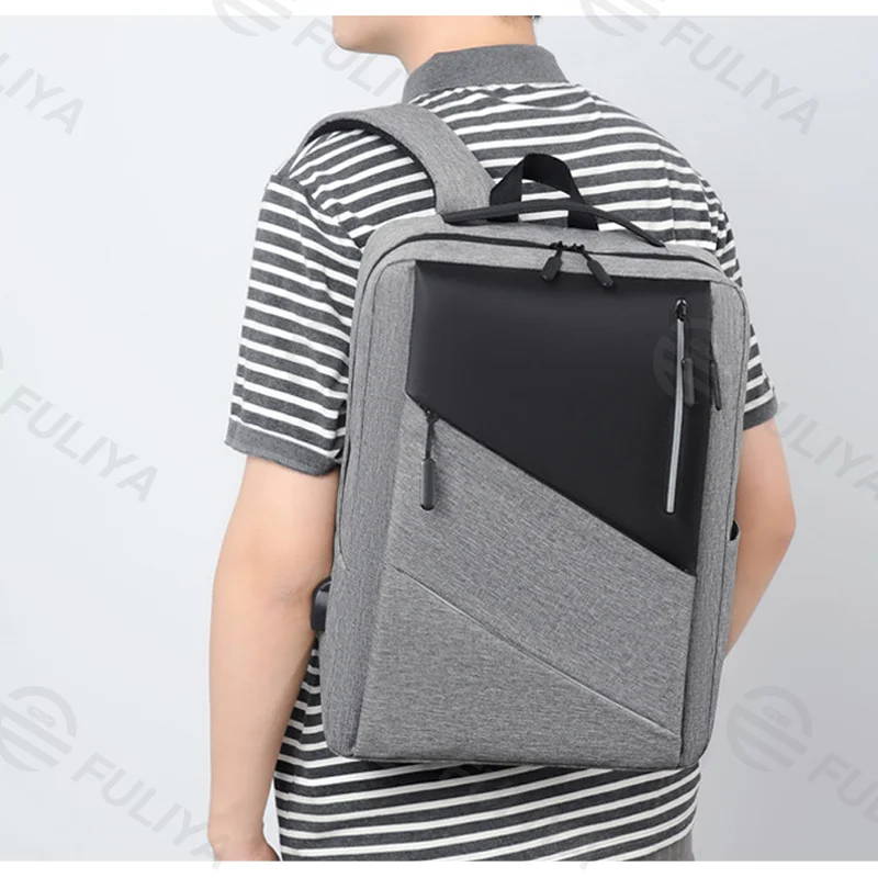 Guangzhou Fuliya Industry Co.,Ltd C-81015 Stylish lightweight backpack, water-resistant, large capacity, laptop compartment, external USB port, comfortable handle, and breathable shoulder straps - for commuting, travel, and casual use.